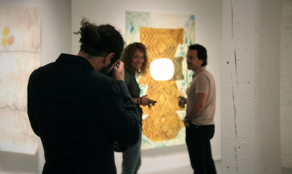 Nick De Pirro taking a picture of artist Sofia Bachvarova and Al Barsky of Barsky Gallery