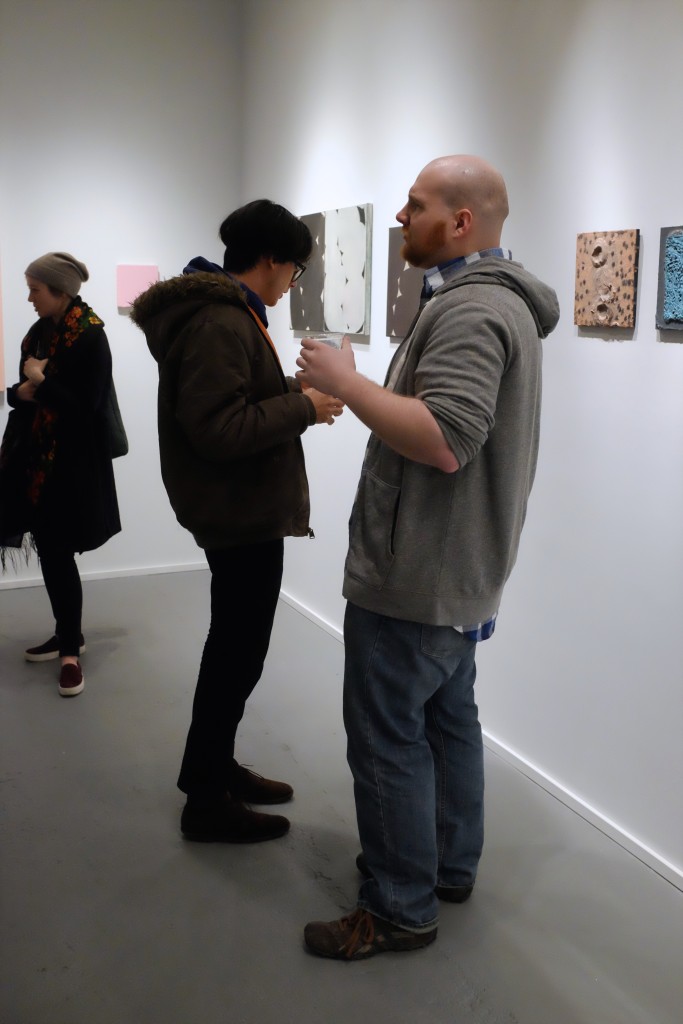 Visitors at the PAIR opening reception at PROTO Gallery